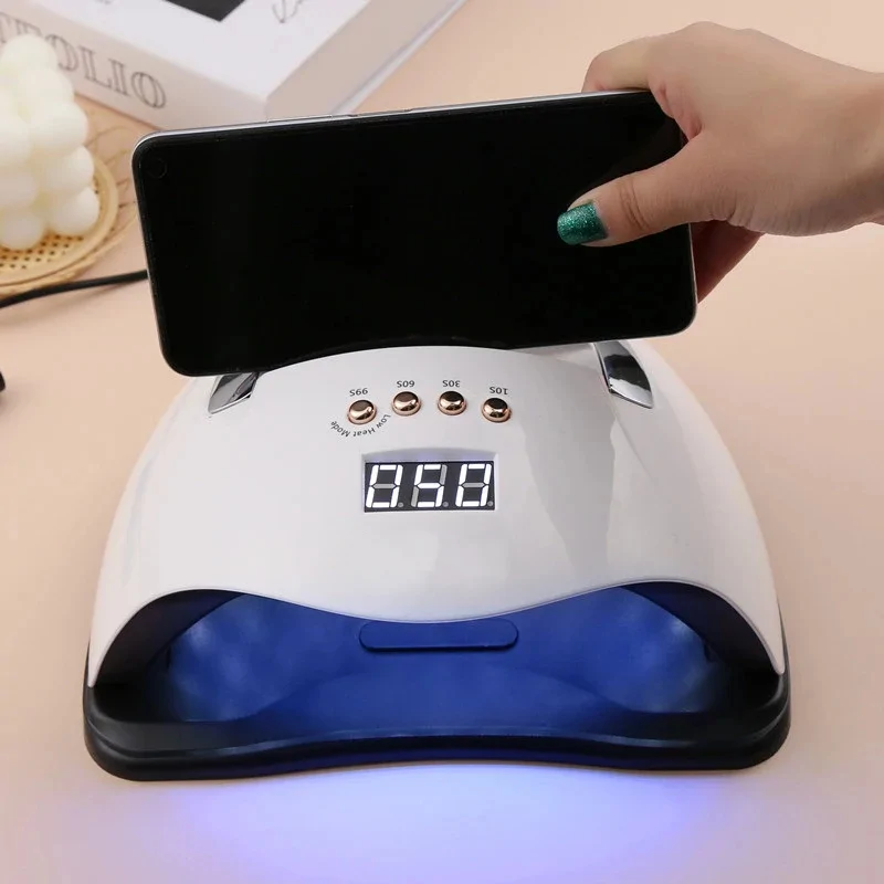 SUN Y9 UV LED professzionális műkörmös lámpa telefontartóval, beépített mozgásérzékelővel és hordozófüllel - 192W