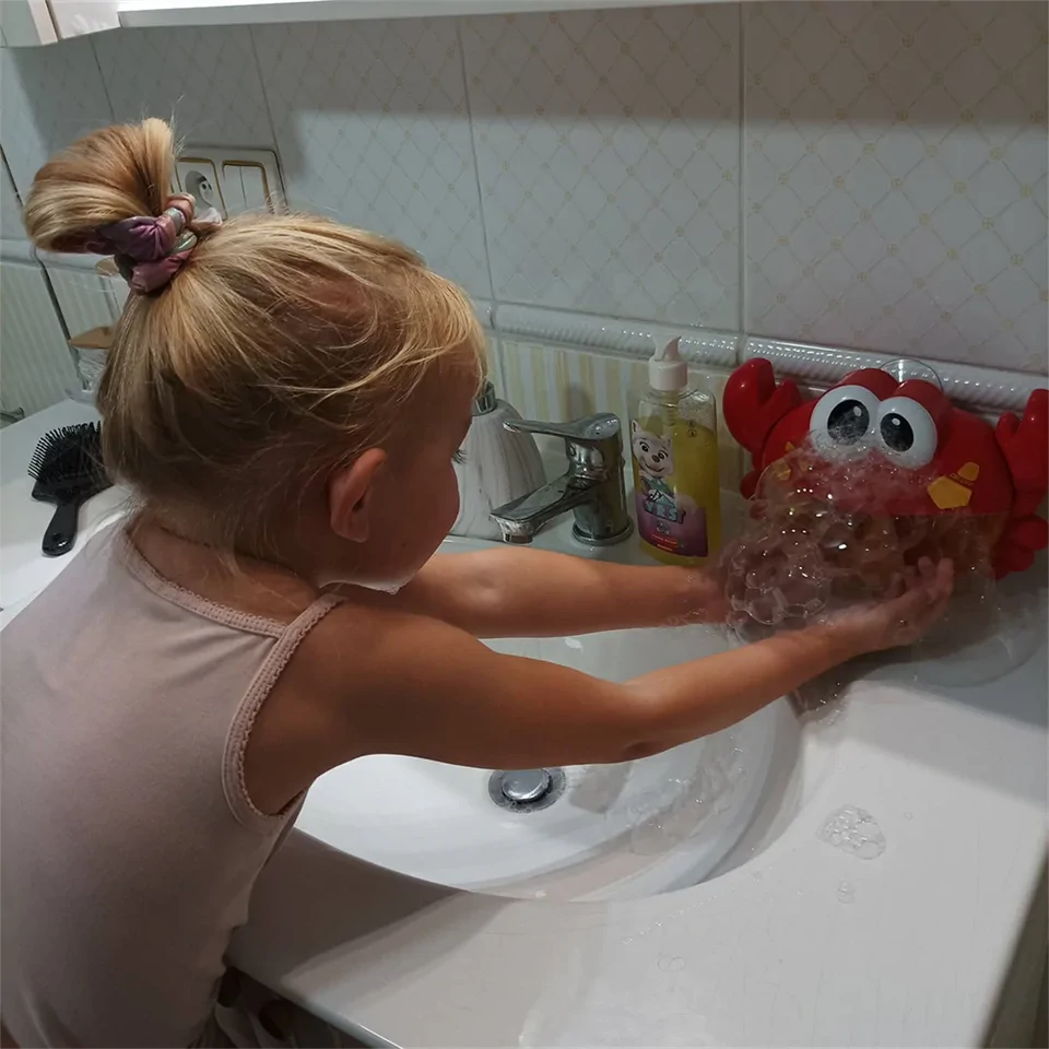 Zenélő, szappanbuborék készítő fürdőjáték - tarisznyarák erős tapadókoronggal, vidám dallamokkal